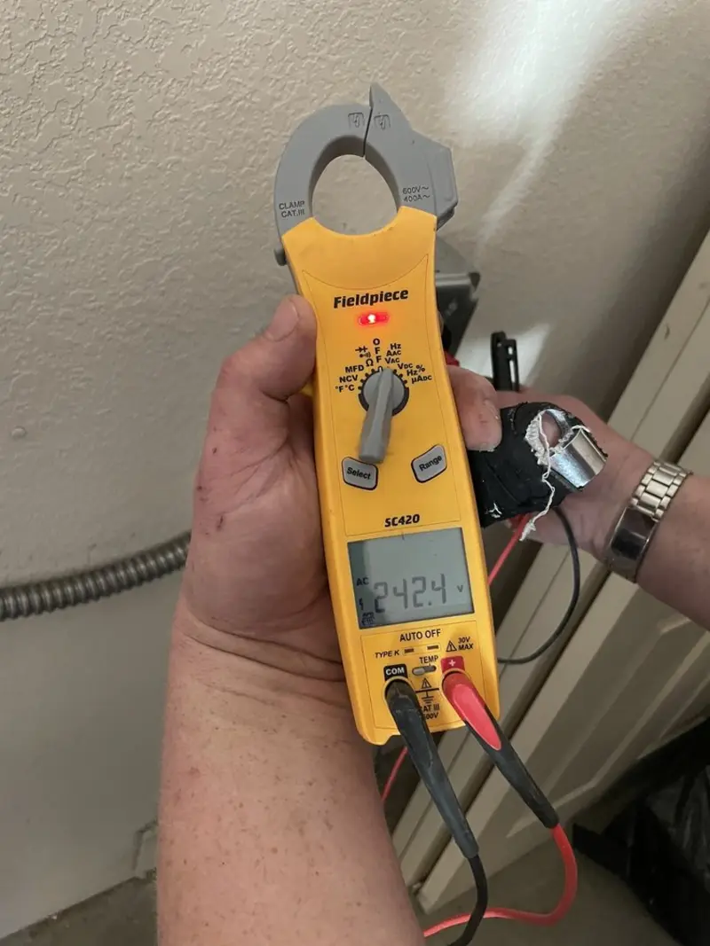 Voltage testing with clamp meter during Ceiling Fan Installation in Hampstead